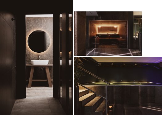 Interni di un centro benessere con bagno elegante, sauna e piscina illuminata.